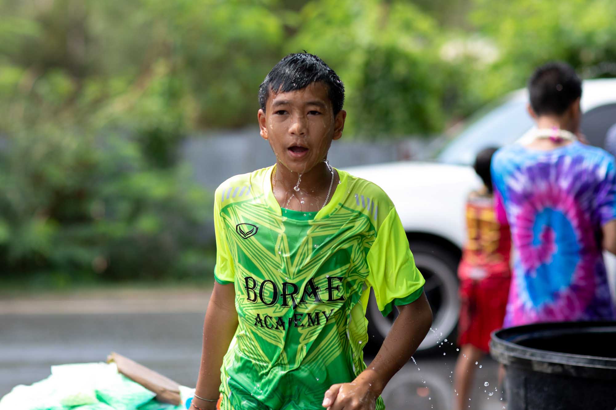 Soaked boy at Songkran water festival in Phuket, Thailand