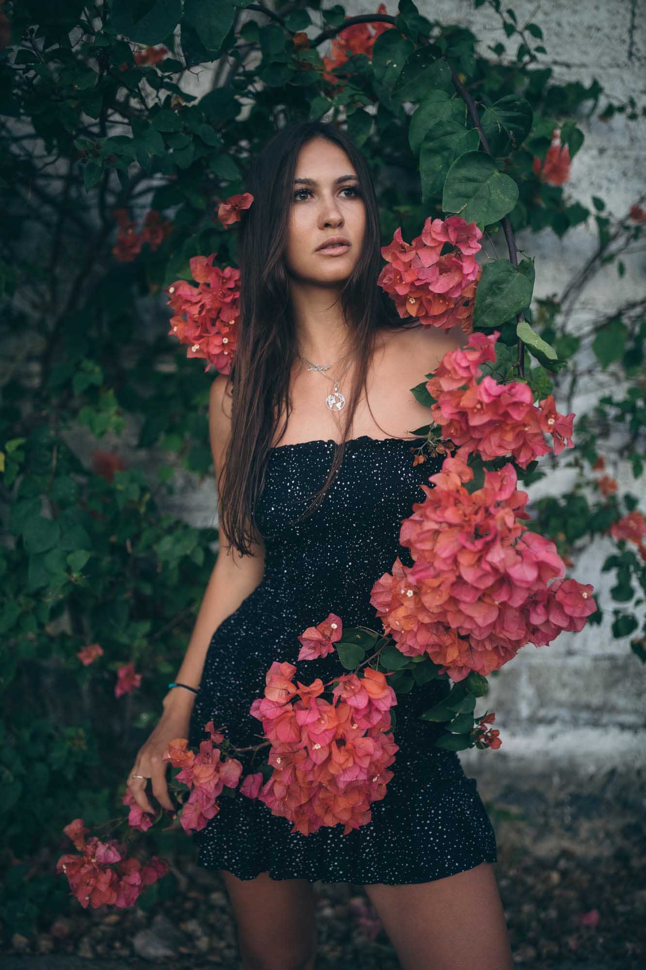 Woman in sexy black dress poses with red flowers | Fashion Photography | Portrait | Lifestyle Photography | Canggu ,Bali, Indonesia | Sexy | Hot | Denver Photographer