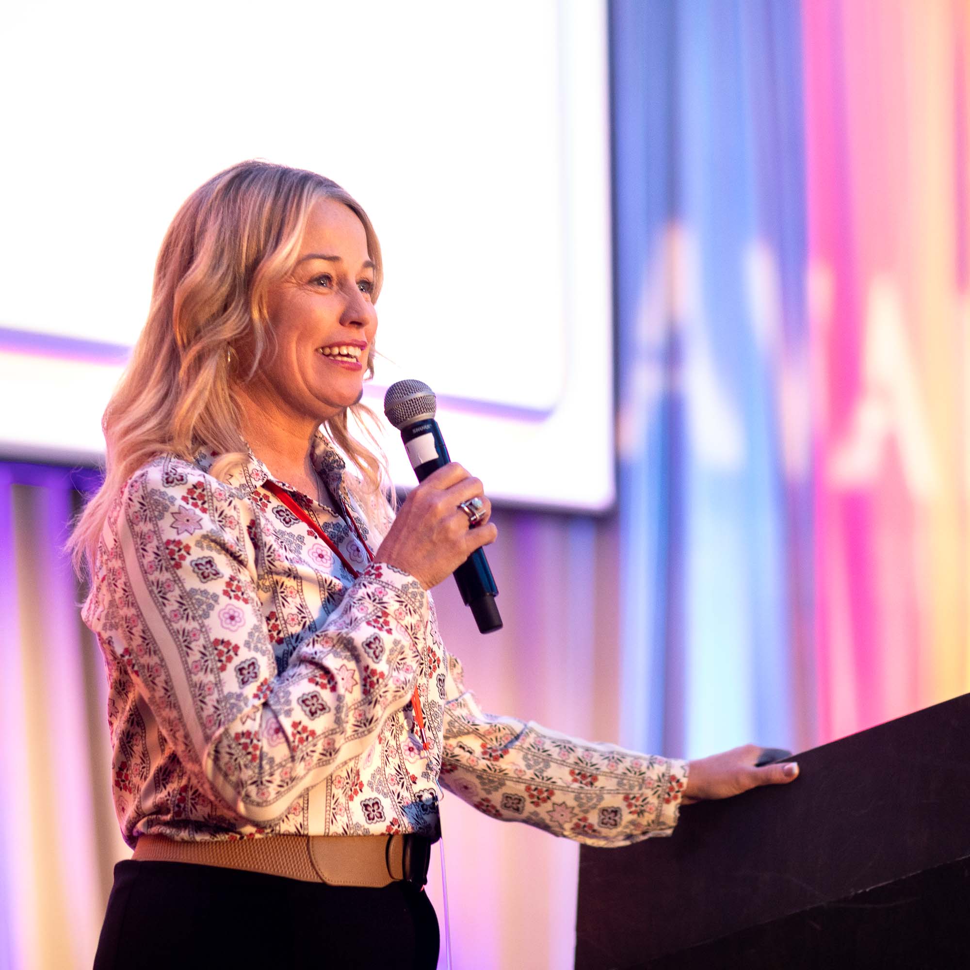 Event Photography of woman giving a speech at a conference