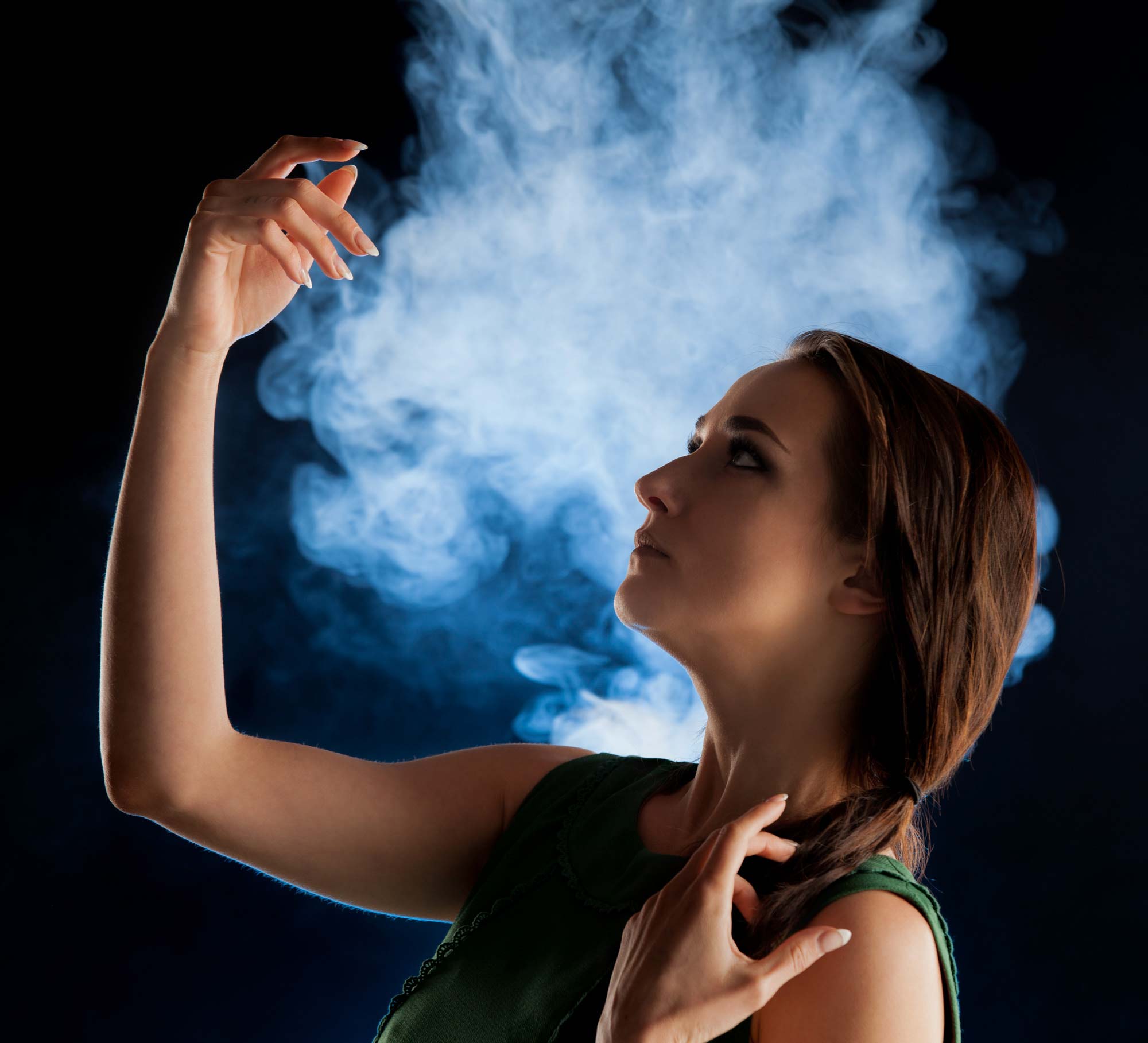 Woman in dramatic portrait with smoke in background | Fashion Photography